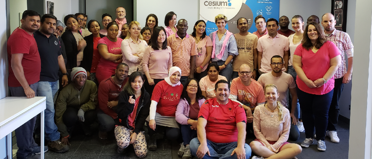 The Cesium team all dressed in pink shirts